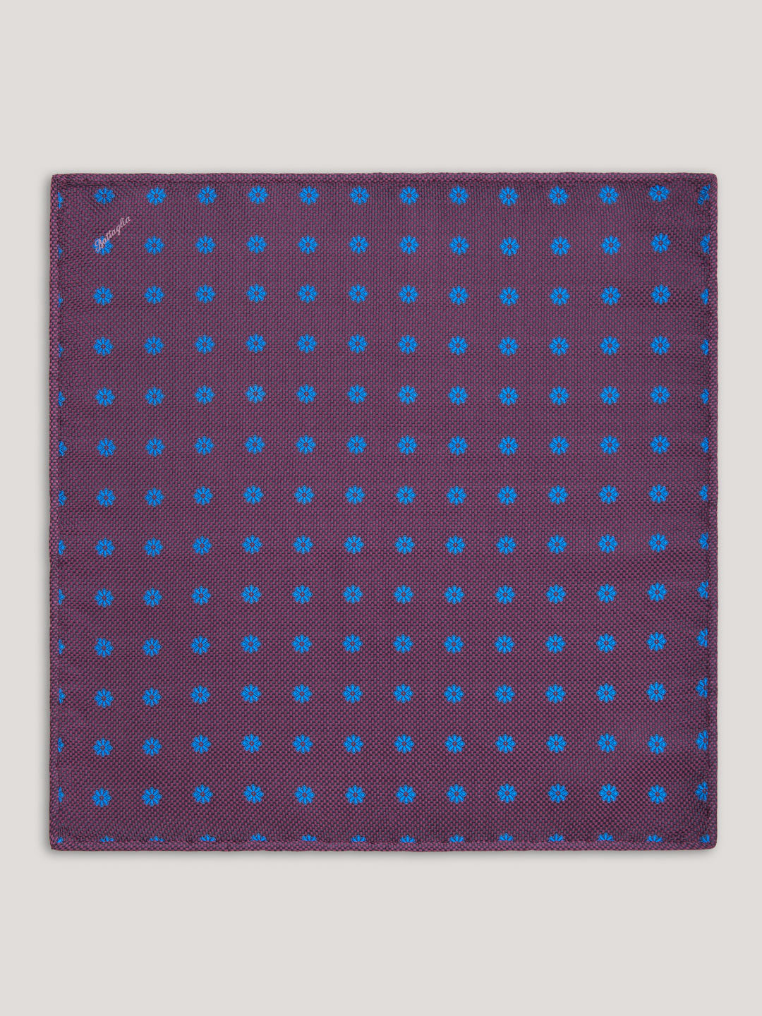 Purple handkerchief with small blue pattern design.