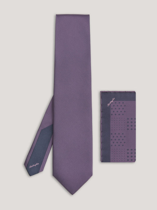 Purple tone on tone tie with small patter design and matching handkerchief. 
