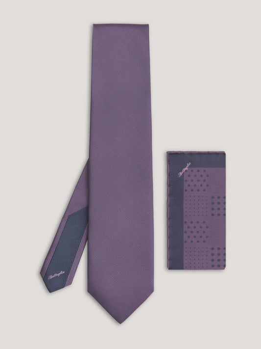 Purple tone on tone tie with small patter design and matching handkerchief.