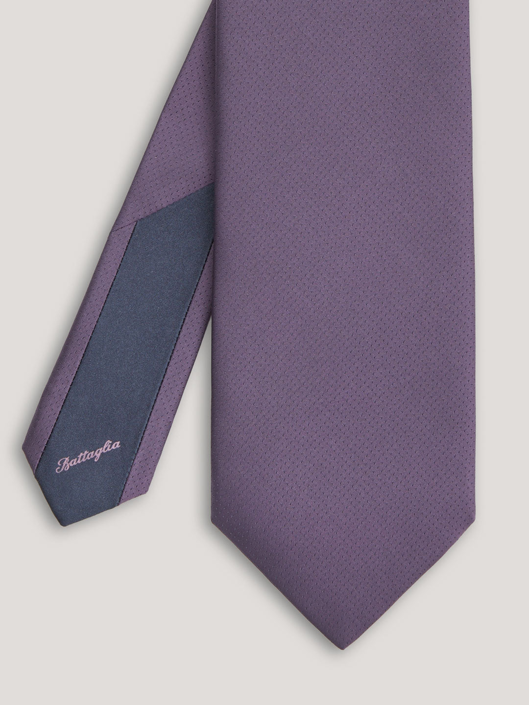 Purple tone on tone tie with small patter design.