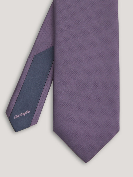 Purple tone on tone tie with small patter design.