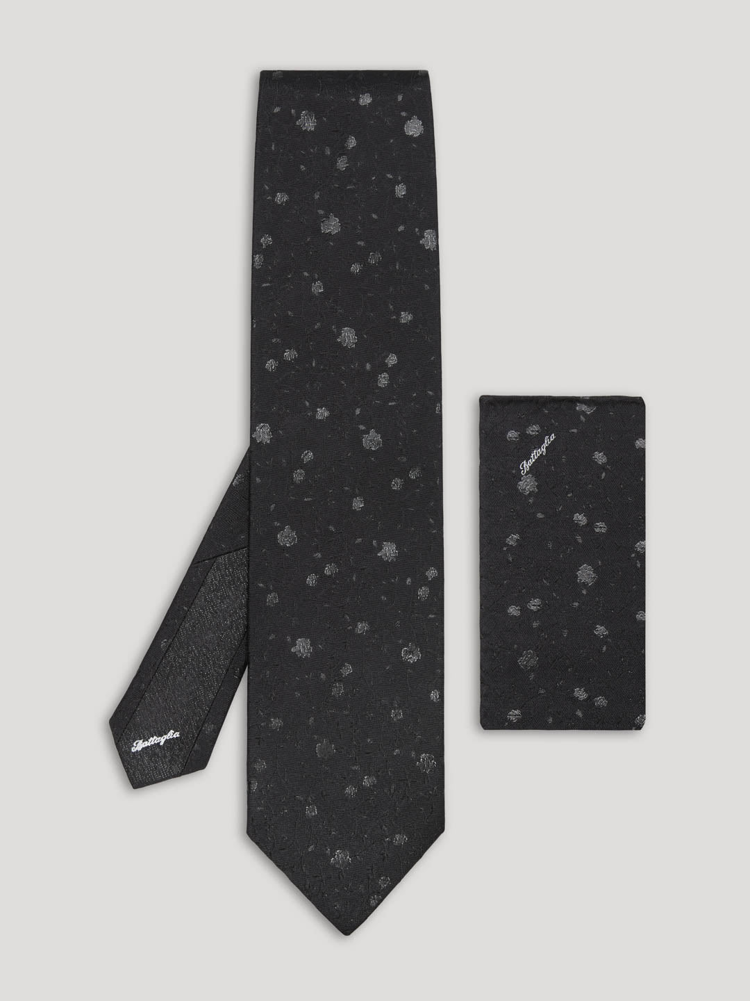 Black silk tie with silver floral details and matching handkerchief. 