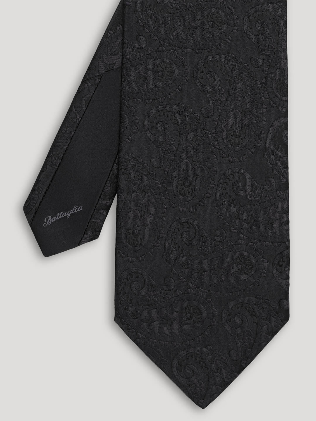 Black tone one tone paisley tie. 