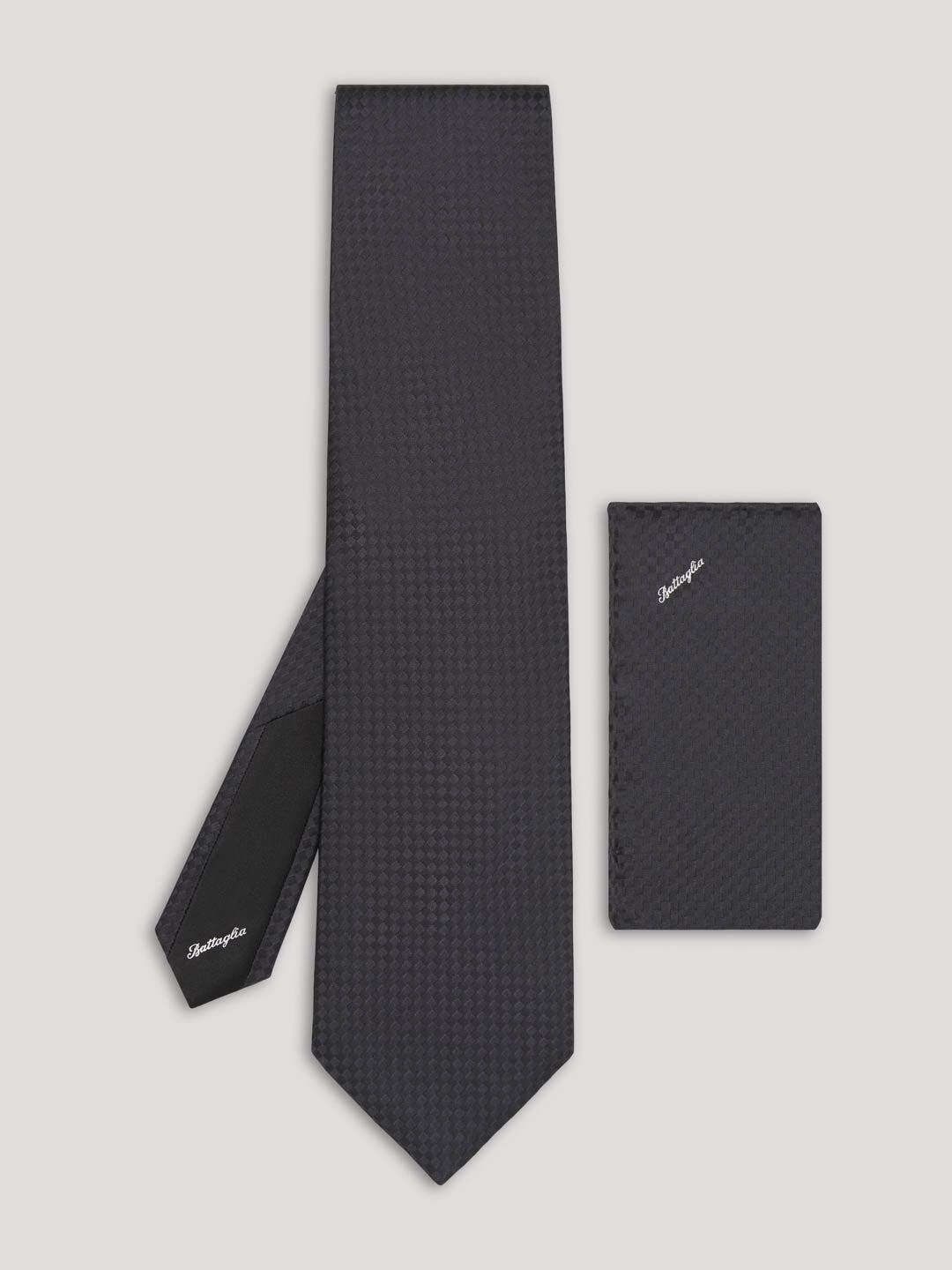 Black tone on tone check pattern silk tie with matching handkerchief. 