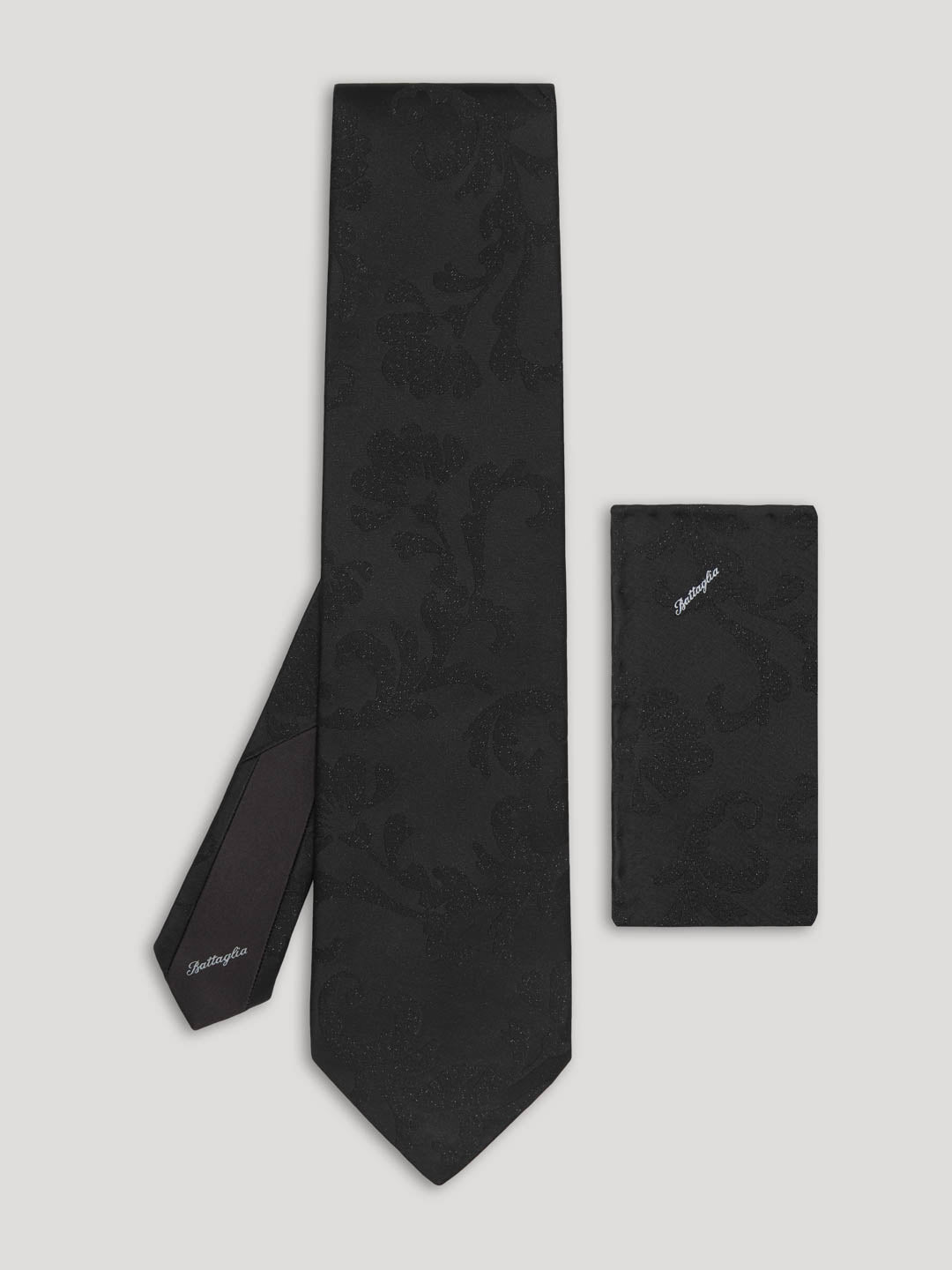 Black tone on tone silk floral tie with matching handkerchief. 