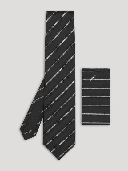Black silk tie with silver stripes and matching handkerchief. 