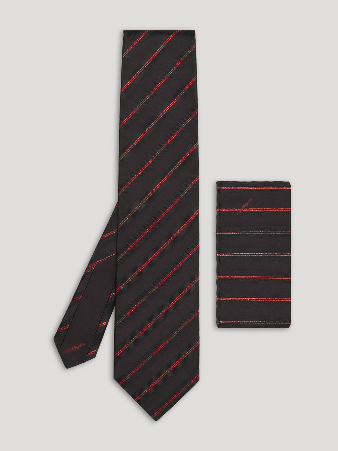 Black tie with red stripes and matching handkerchief. 