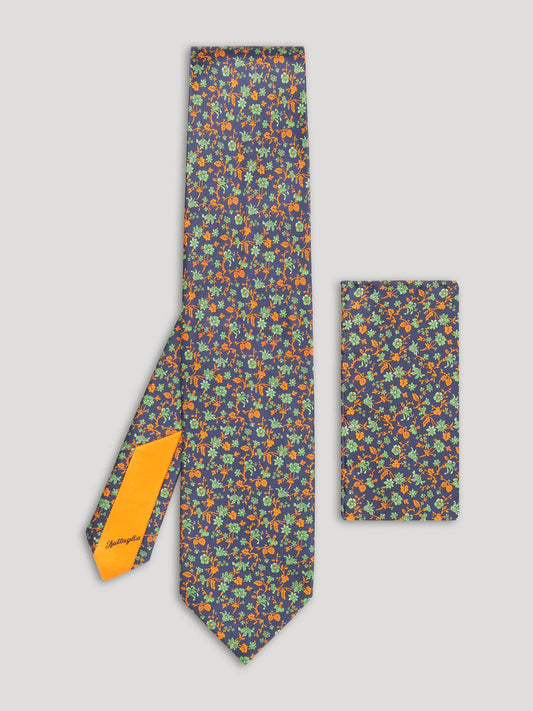 Blue, green, and orange floral tie with matching handkerchief. 