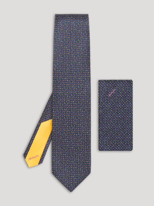 Navy blue floral tie with pink and yellow floral details and matching handkerchief. 