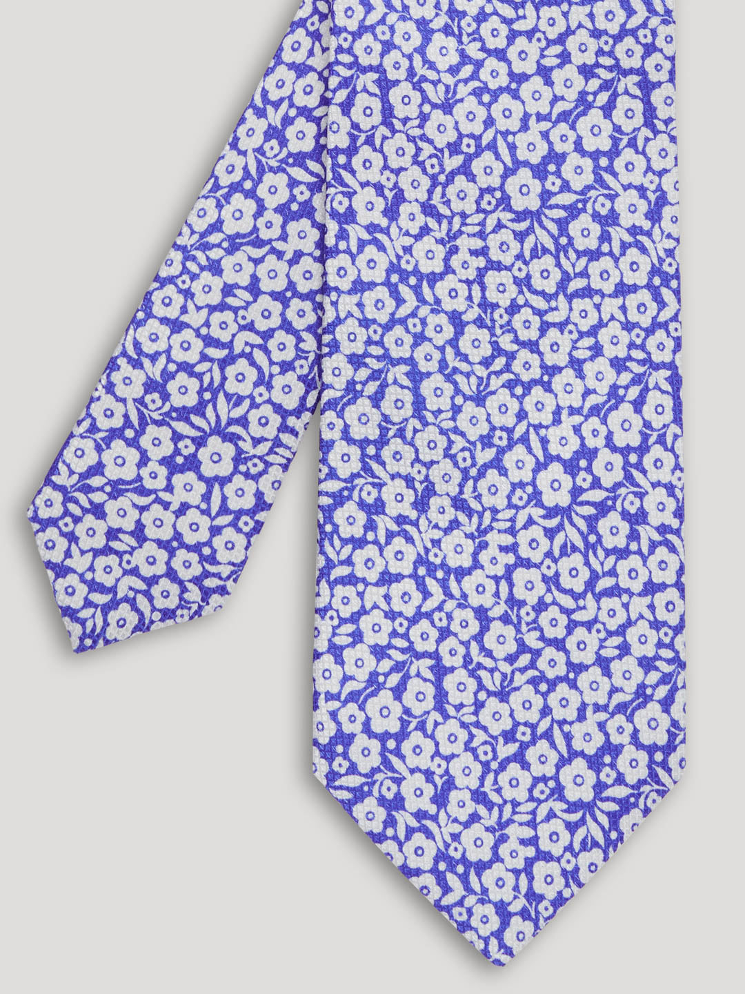 Violet blue tie with silver flowers. 