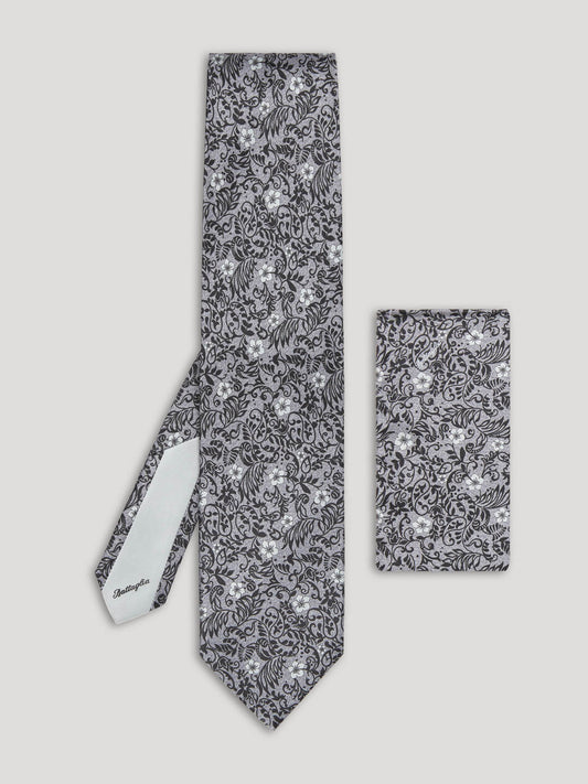 Black and silver floral tie with matching handkerchief.