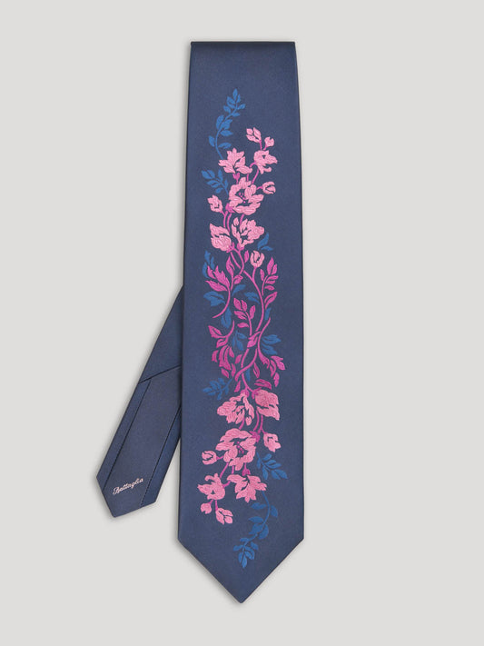 Navy tie with woven pink and blue floral design. 