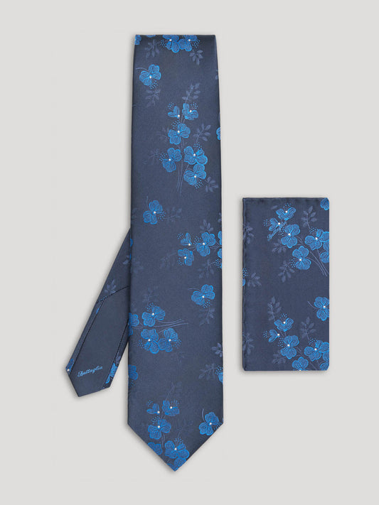 Navy tie with blue woven floral details and matching handkerchief. 