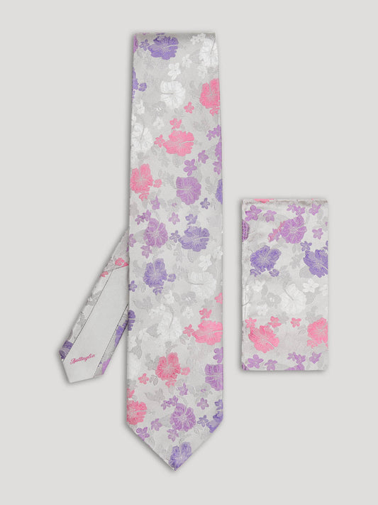 Silver tie with pink and purple flowers and matching handkerchief.