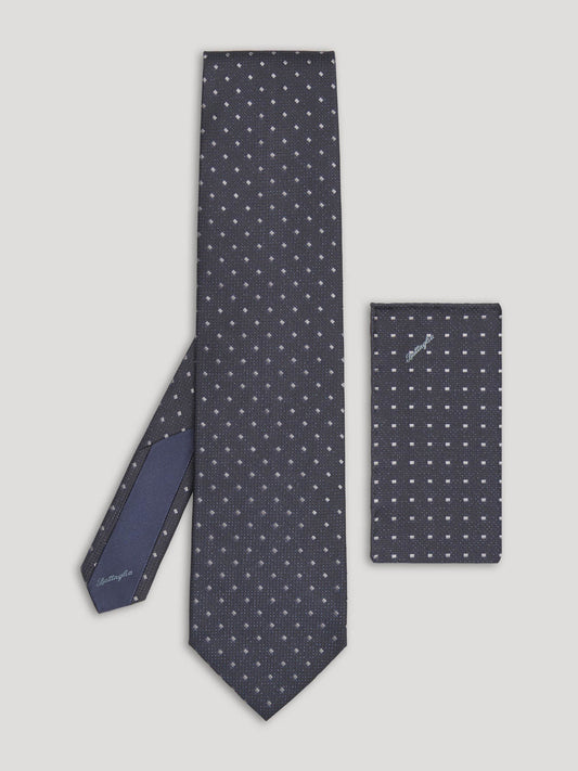 Black tie with small grey diamond design and matching handkerchief. 