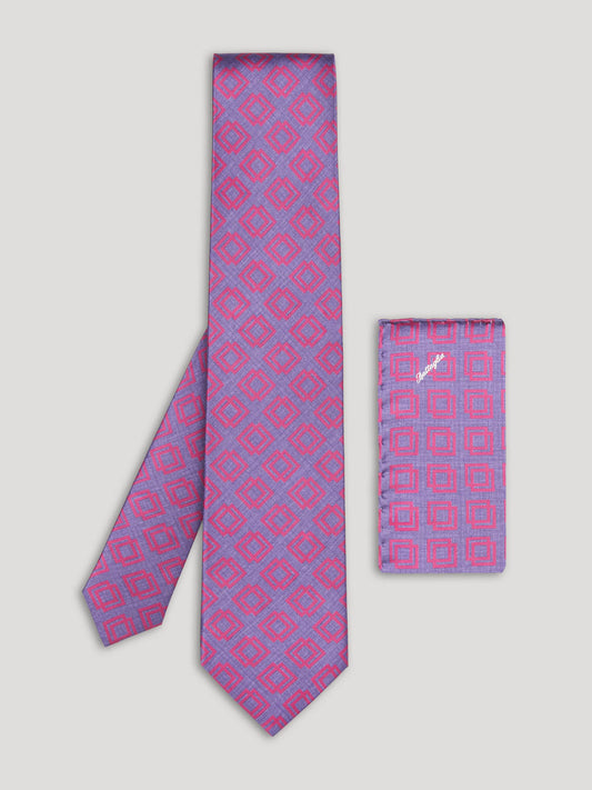 Pink and purple tie with geometric design and matching handkerchief.