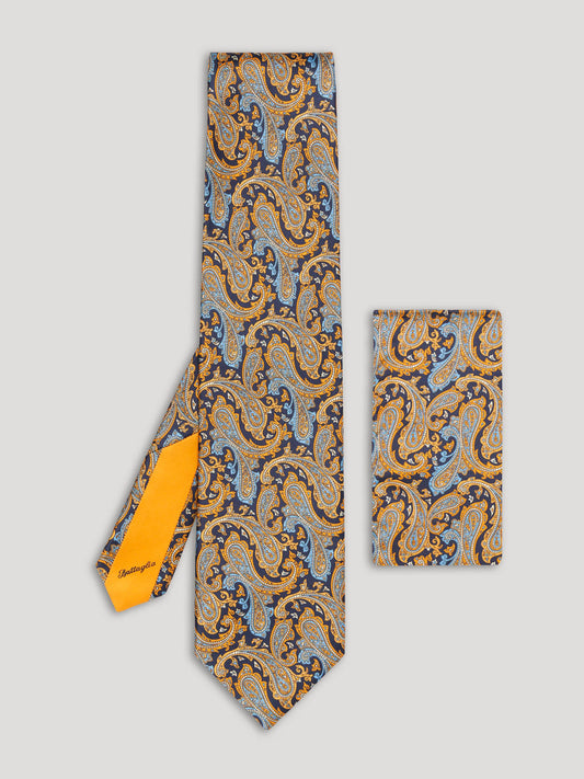 Yellow and blue paisley tie with matching handkerchief. 
