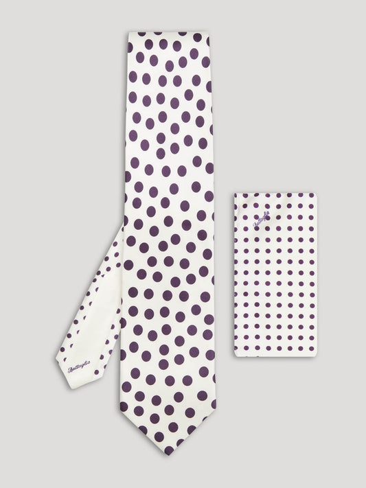 White tie with large purple polkadots and matching handkerchief. 