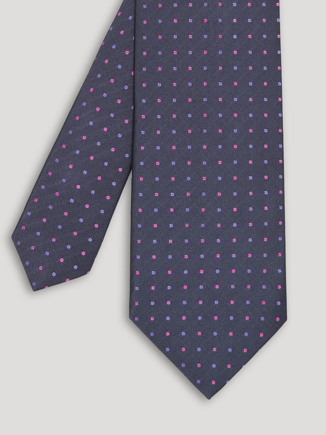 Purple tie with pink and blue polkadots. 