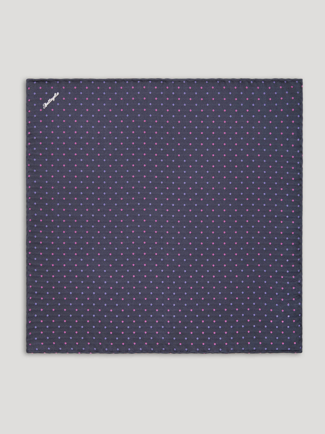 Purple handkerchief with pink and blue polkadots. 