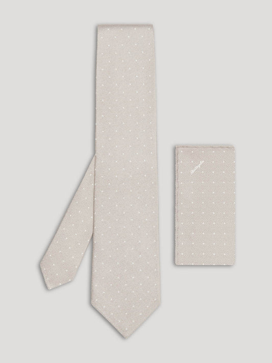 Light grey tie with white polkadots and matching handkerchief. 