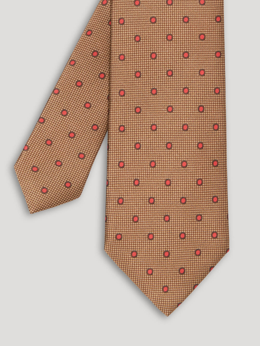 Brown tie with small red polkadots. 