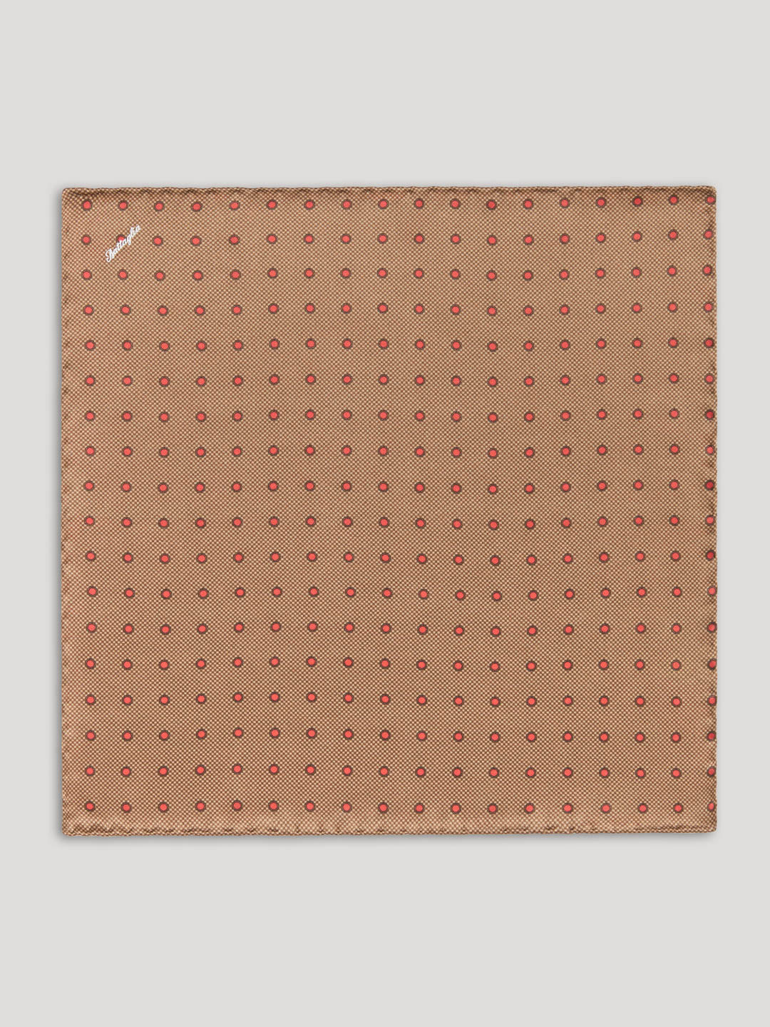 Brown handkerchief with red polkadots. 