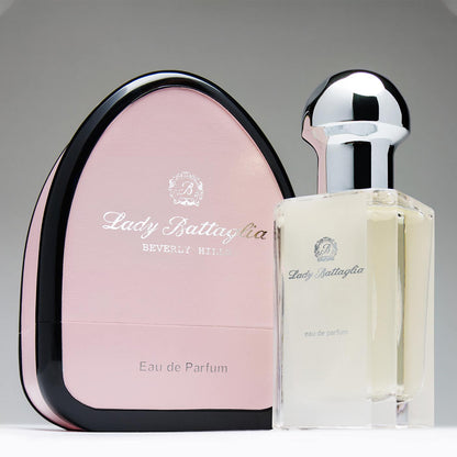 Lady Battaglia is a delicate and powdery perfume for women who are attracted to soft, elegant, and graceful scents. Photo shows the Lady Battaglia bottle next to its pink box. 